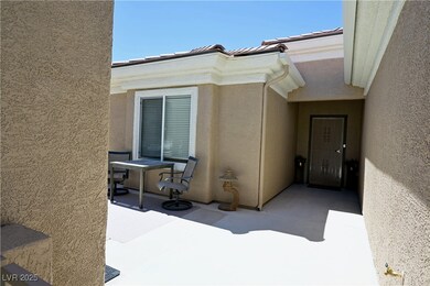 Property entrance with stucco siding