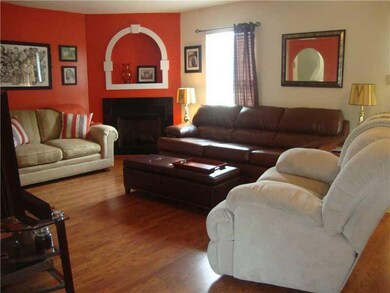 Living Room. Corner Gas Fireplace and Shelving Acc