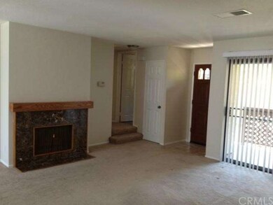 Living Room with marble fireplace & sliding doors 