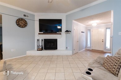 Unfurnished living room featuring a fireplace, cei