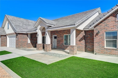 Brick exterior and patio with view of majestic sun