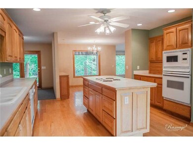 Kitchen. Beautiful custom cabinets galore and hardwood floors in this chefs delight kitchen