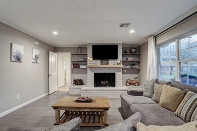 Beautiful family room that overlooks the backyard complete with a wood burning fireplace.