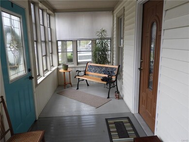cozy enclosed front porch