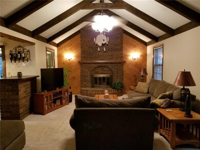 Huge living room with floor to ceiling gas firepla