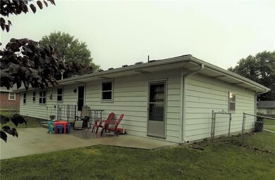 Roomy concrete patio for playing and grilling.
