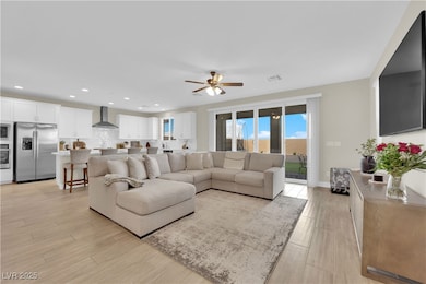 Living area featuring visible vents, recessed ligh