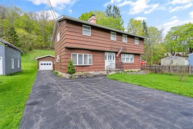 The driveway is double-wide to the house, then sin