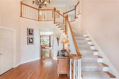 Stunning foyer with hardwood floors.
