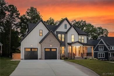 Modern inspired farmhouse featuring a garage, a po