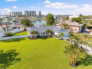 Oversized corner lot with new dock, lift, and seawall.