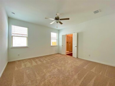 Carpeted empty room with ceiling fan