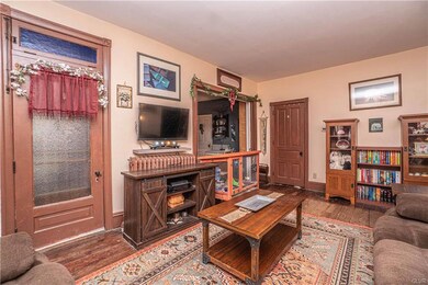 The custom front door maintains the look of the original transom overhead window