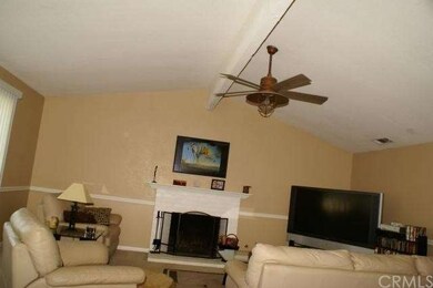 Open living room with fireplace to keep the family