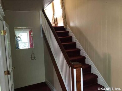 Foyer. From front door leading to stairs.