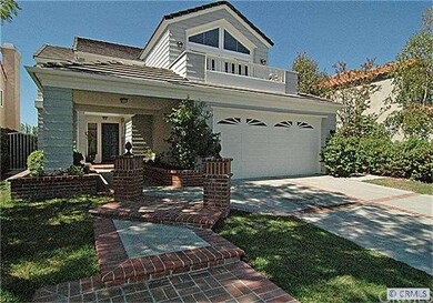 Concrete driveway with brick ribbon in-lay. Concre