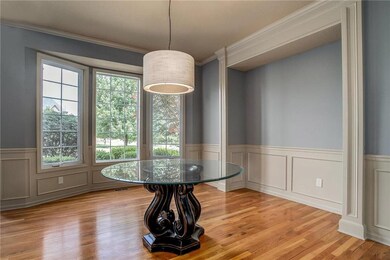 Hardwood floors and bay window.