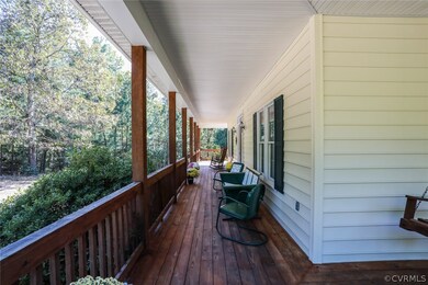 SPRAWLING COVERED FRONT PORCH WITH SWING!