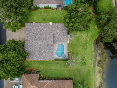 Over view of home, pool, and pond.