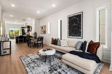 Living room with light hardwood / wood-style floor
