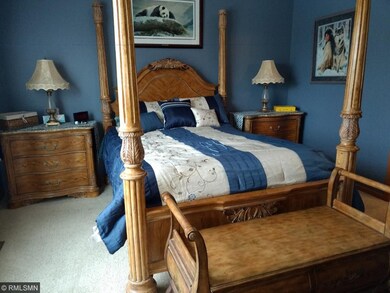 Another view of the master bedroom suite with 12 f
