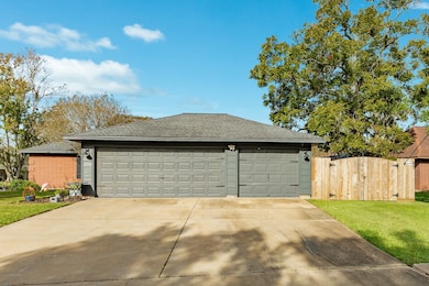 Triple Car Garage: Ample garage space includes a workbench and an extra sink, perfect for projects and storage. Also, a triple wide driveway is a definite plus.