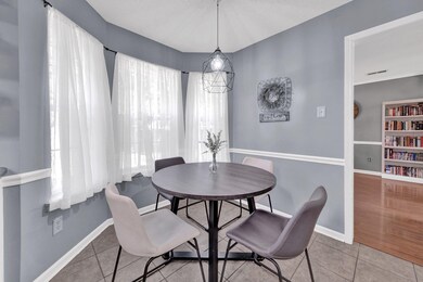 Dining space featuring tile patterned flooring and baseboards