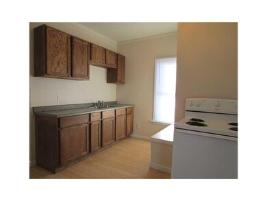 Kitchen. Kitchen cabinet area laminate floor.