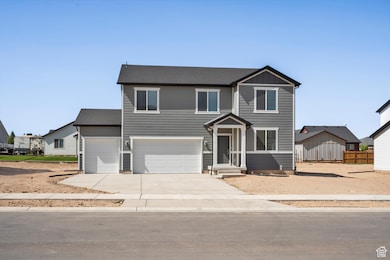 Traditional-style house featuring concrete driveway and a garage