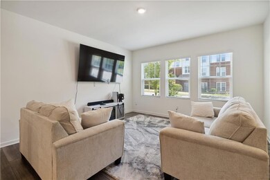Living room with dark hardwood / wood-style floori