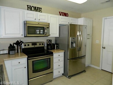 Kitchen. Great storage space in kitchen.  Door exits to garage.
