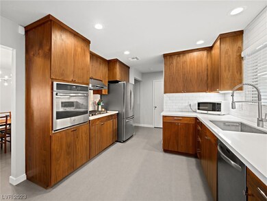 Beautiful flat-panel walnut cabinets are a re-crea