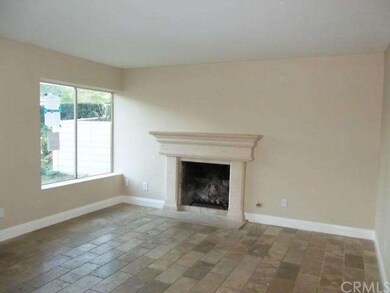 FRONT LIVING ROOM WITH TRAVERTINE FLOORING AND FIR