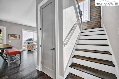 beautiful staircase to the upper level from entry
