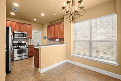 Kitchen with appliances with stainless steel fini