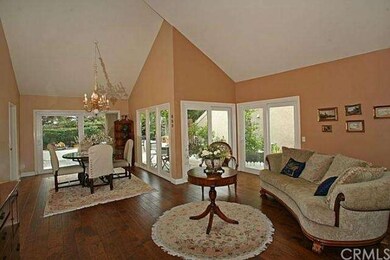The formal dining and living rooms enjoy views to 