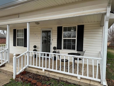 Property entrance with covered porch