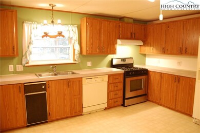 Good amount of storage cabinets, gas range, side by side refrigerator