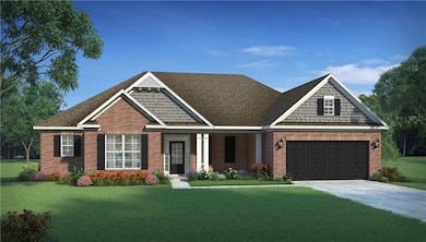 Craftsman house with a front yard, brick siding, and concrete driveway