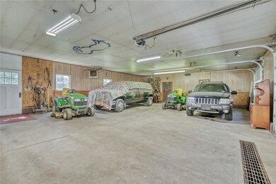 Spacious garage/shop with overhead door access on