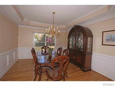 Formal Dining Room with tray ceiling, wainscoting 