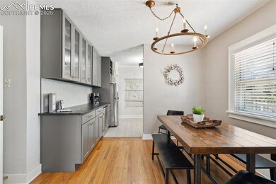 Kitchen/Dining area with both wood and tile flooring.