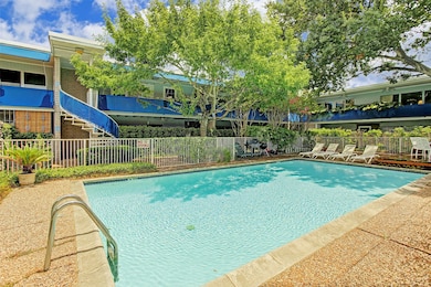 The sparkling pool at Lamar Townhomes serves as th