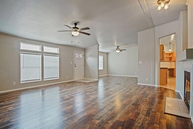 Living room view of dining room, dark wood-look fl