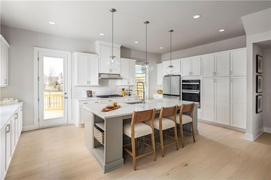 Kitchen featuring appliances with stainless steel 