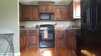 The open concept extends to the kitchen with gorgeous cabinetry and plenty of countertop space. All appliances (Refrigerator, Dishwasher, Stove/Oven, Microwave) are included in as-is condition.