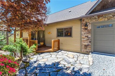 With stone & bark accents, a flagstone patio and m