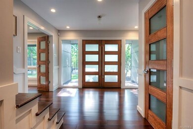 Alternate view of the foyer with a coat closet and