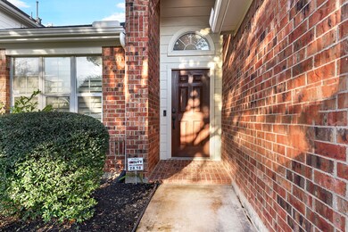 A welcoming sidewalk leads up to your front door, featuring keyless entry for added convenience and a Ring camera system for enhanced security.