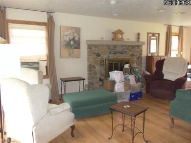 Large living room with beautiful Fieldstone firepl